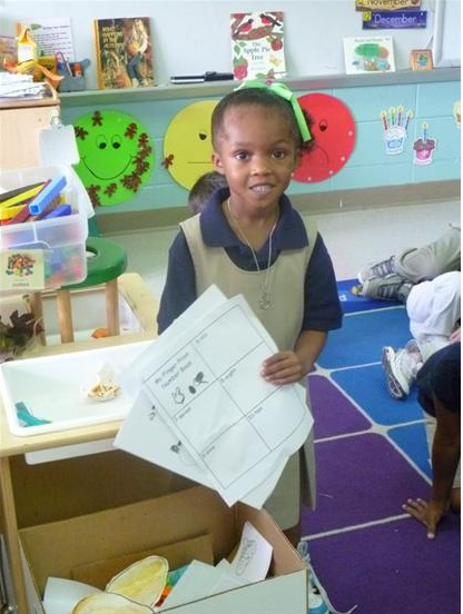 Girl showcases her school work