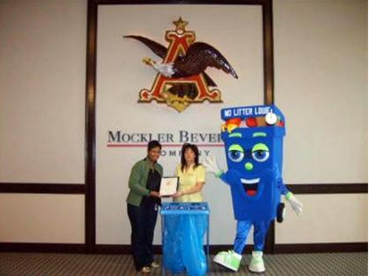 Person accepts recycling award