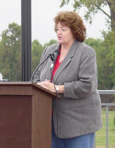 Woman talking at the podium during the dedication